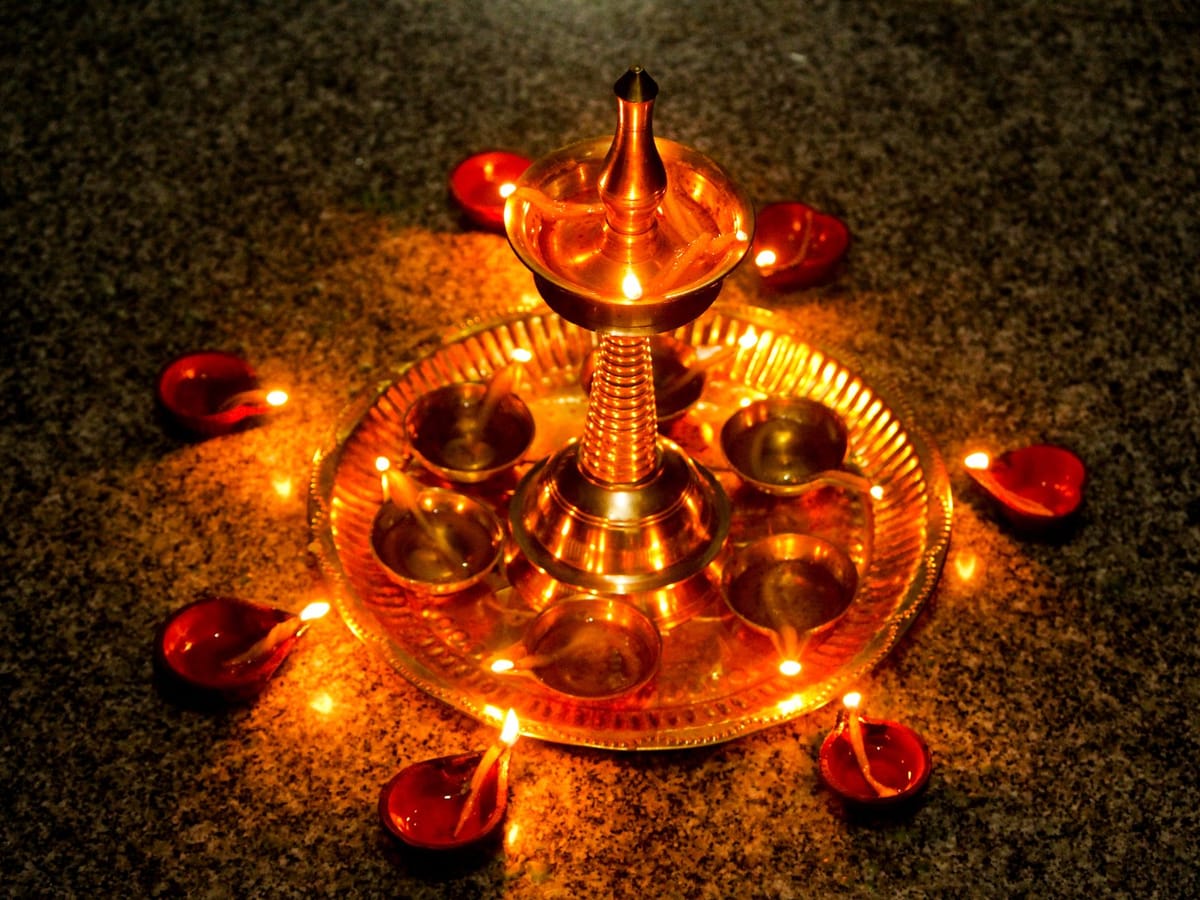 Traditional brass oil lamps (diyas) arrangement